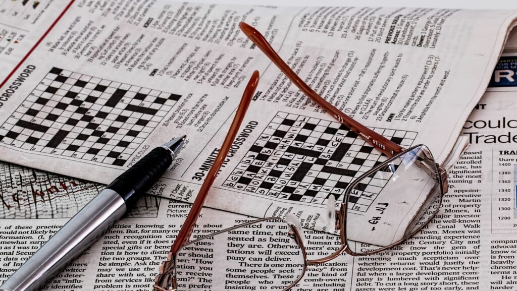 puzzle book challenges crossword clue